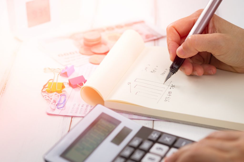 A business owner calculating their asset turnover ratio