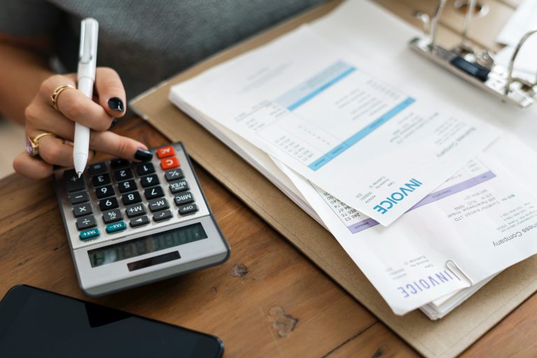 A person calculating the net working capital formula