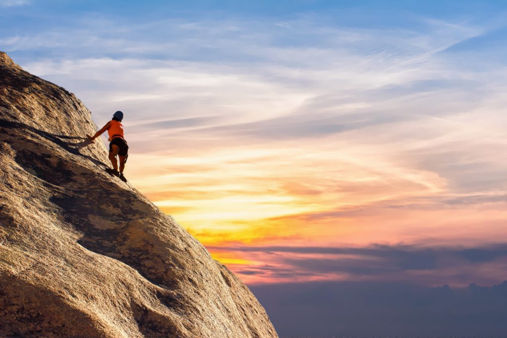 a mountain climber looking at an inspirational view