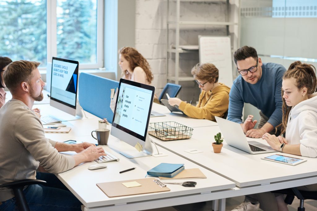 A group of employees going over their business productivity guides