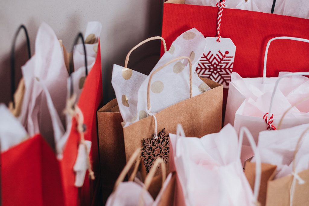 Multiple holiday gift bags to signify seasonality in business