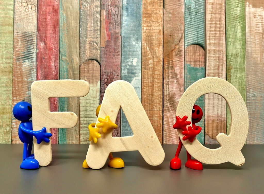 FAQ spelled out in wood for getting small business loans