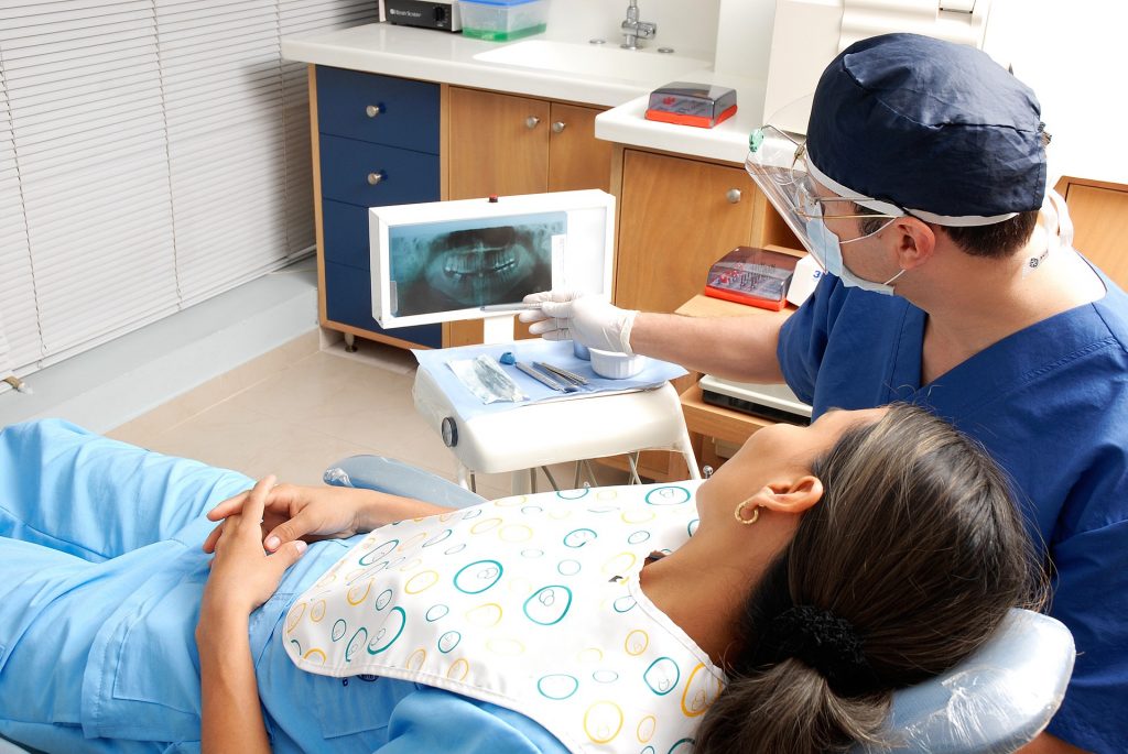 Dentist showing patient an x-ray of their mouth