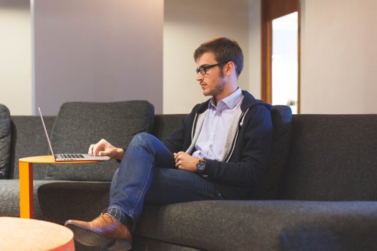 man on couch, laptop, owner's equity, owner equity