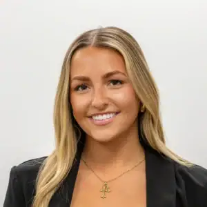 Professional woman smiling, representing United Capital Source financial services.
