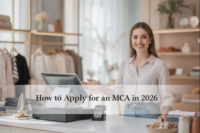 How to Apply for a Merchant Cash Advance Online in 2026 - A friendly and welcoming merchant stands behind a checkout counter in a local boutique retail store, smiling as they greet customers. The modern point-of-sale register with an attached card reader emphasizes the business's commitment to efficient transactions and receiving payments, creating an atmosphere of trustworthiness and success.